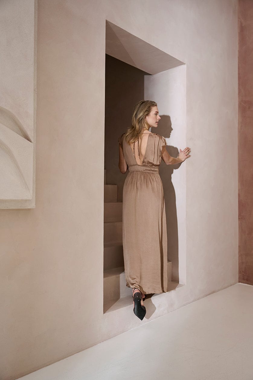 Feminine gathered waist dress with cap sleeves and tie-back detail