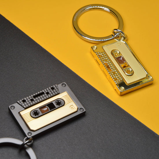 Oli Olsen Metalmorphose Matt Grey & Gold Cassette Tape Keyring